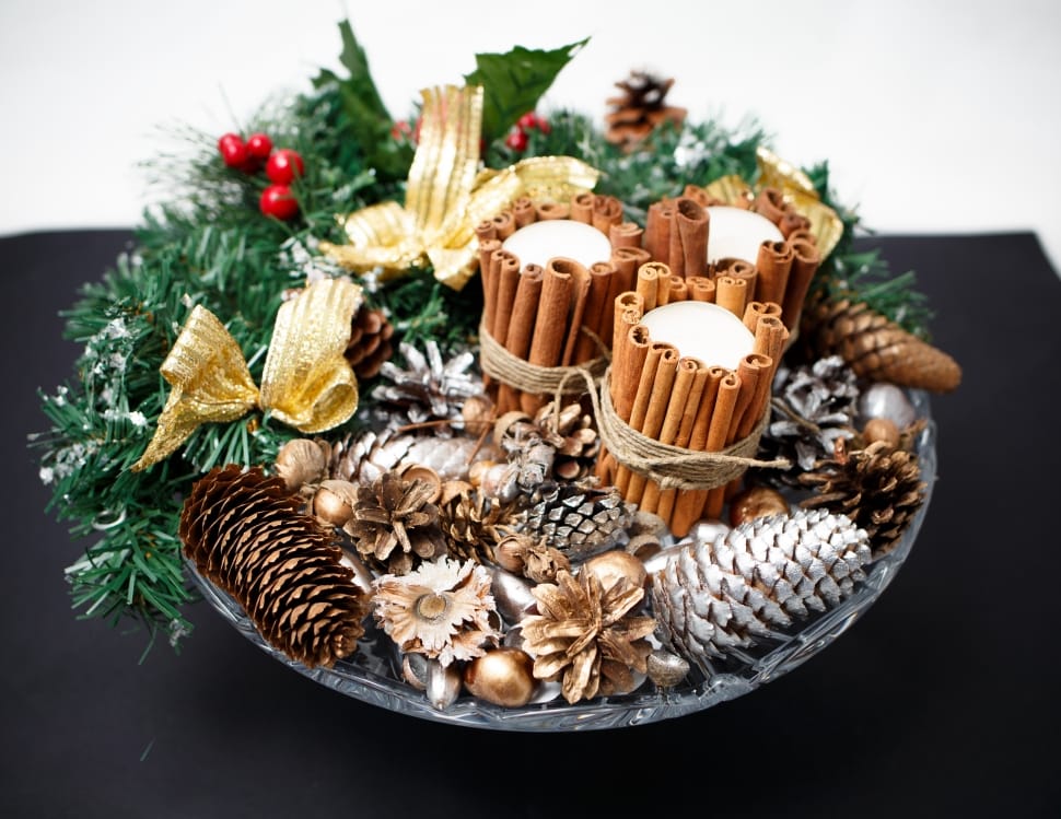 brown and silver pine cones on plate with wreaths preview