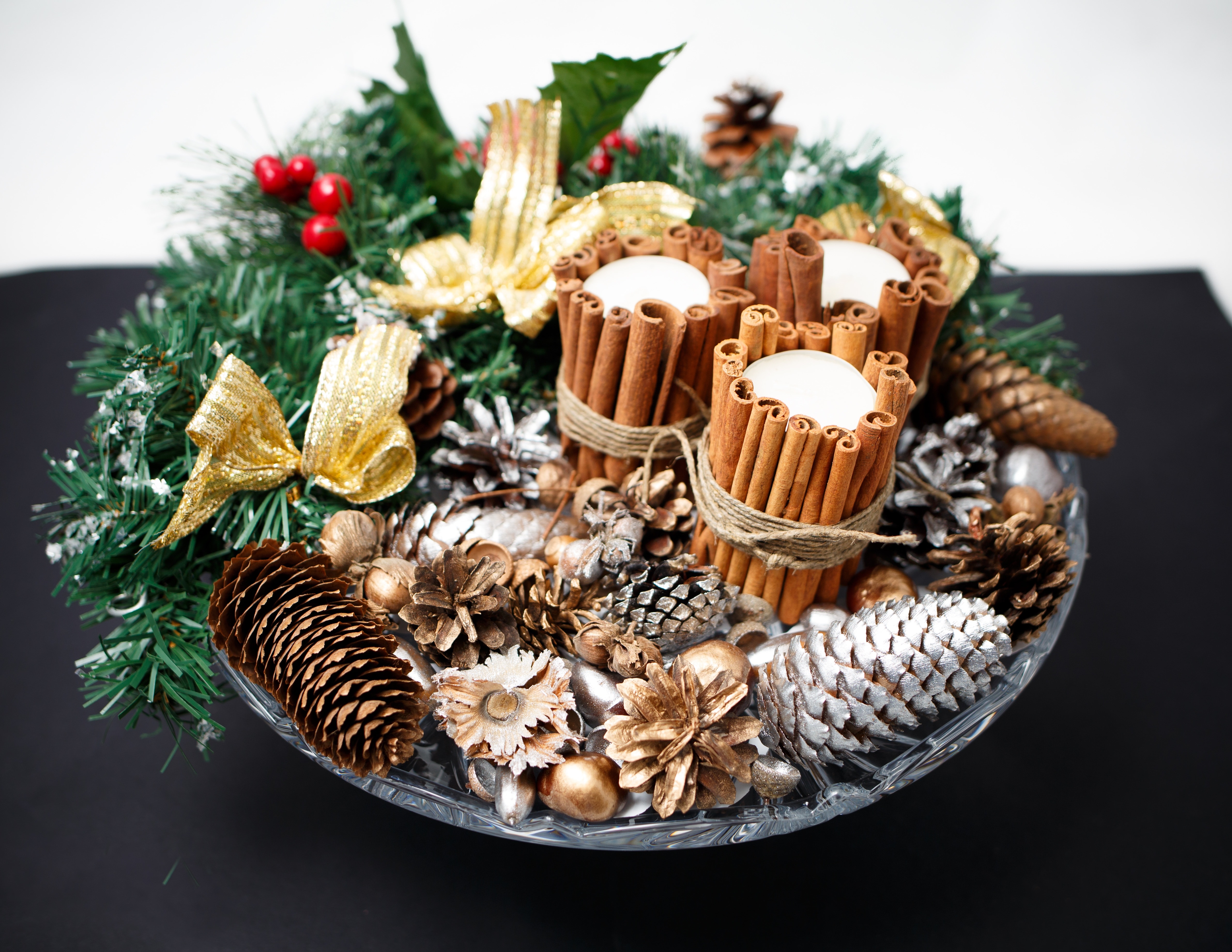 brown and silver pine cones on plate with wreaths