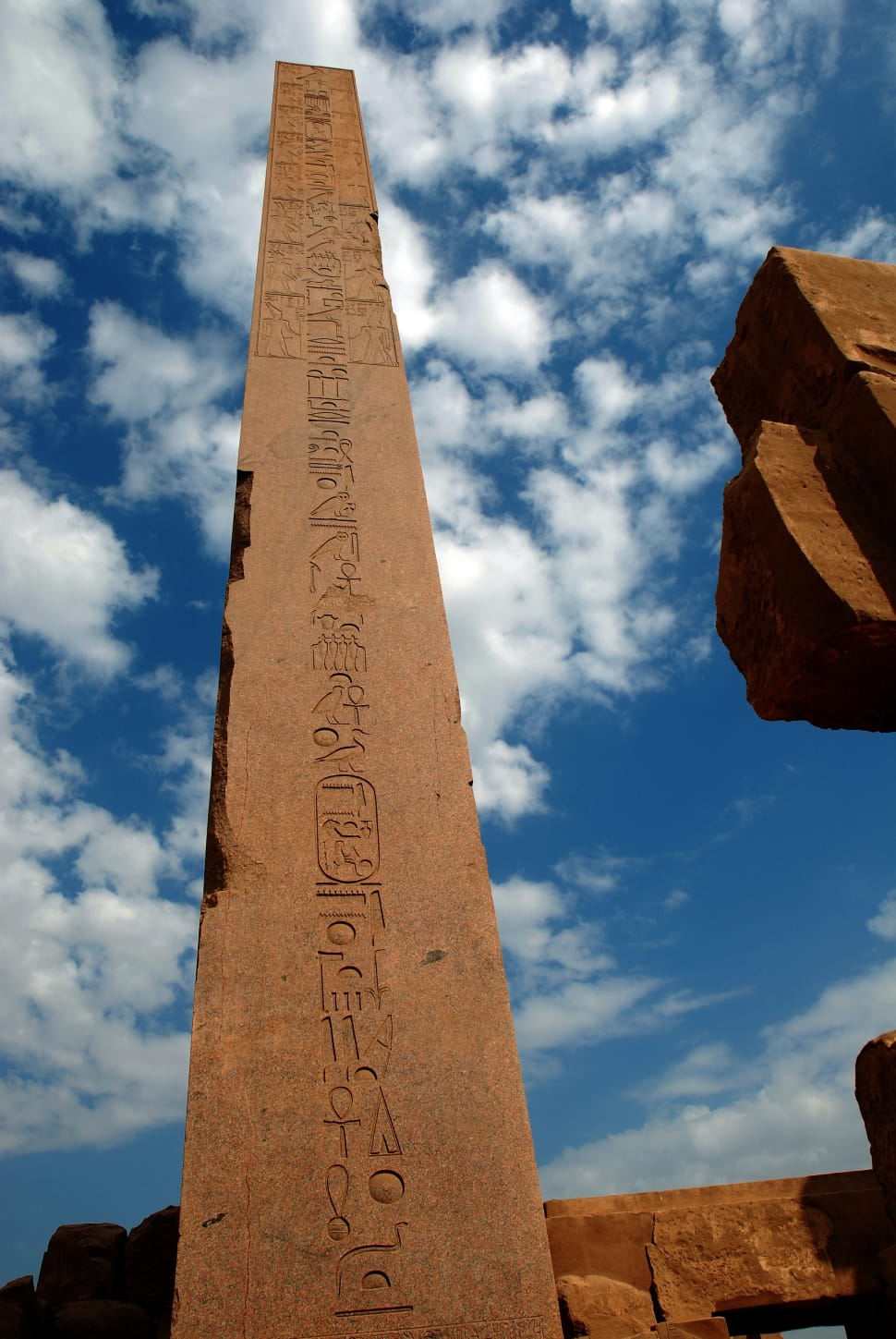 brown concrete tower with hieroglyphics embossed preview