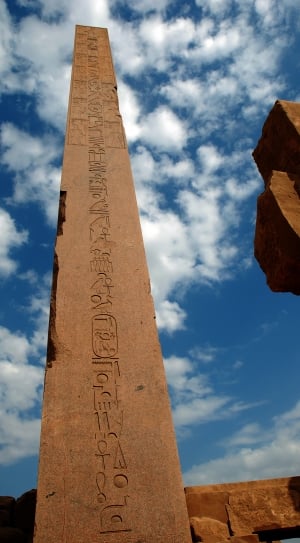 brown concrete tower with hieroglyphics embossed thumbnail