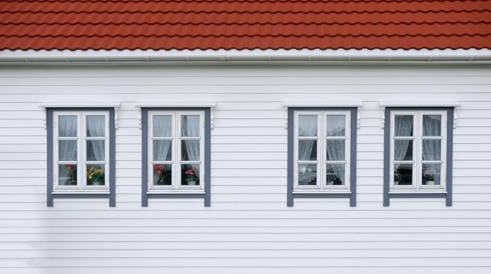 photo of white wooden wall with 4 windows preview