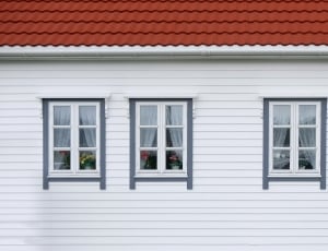 photo of white wooden wall with 4 windows thumbnail