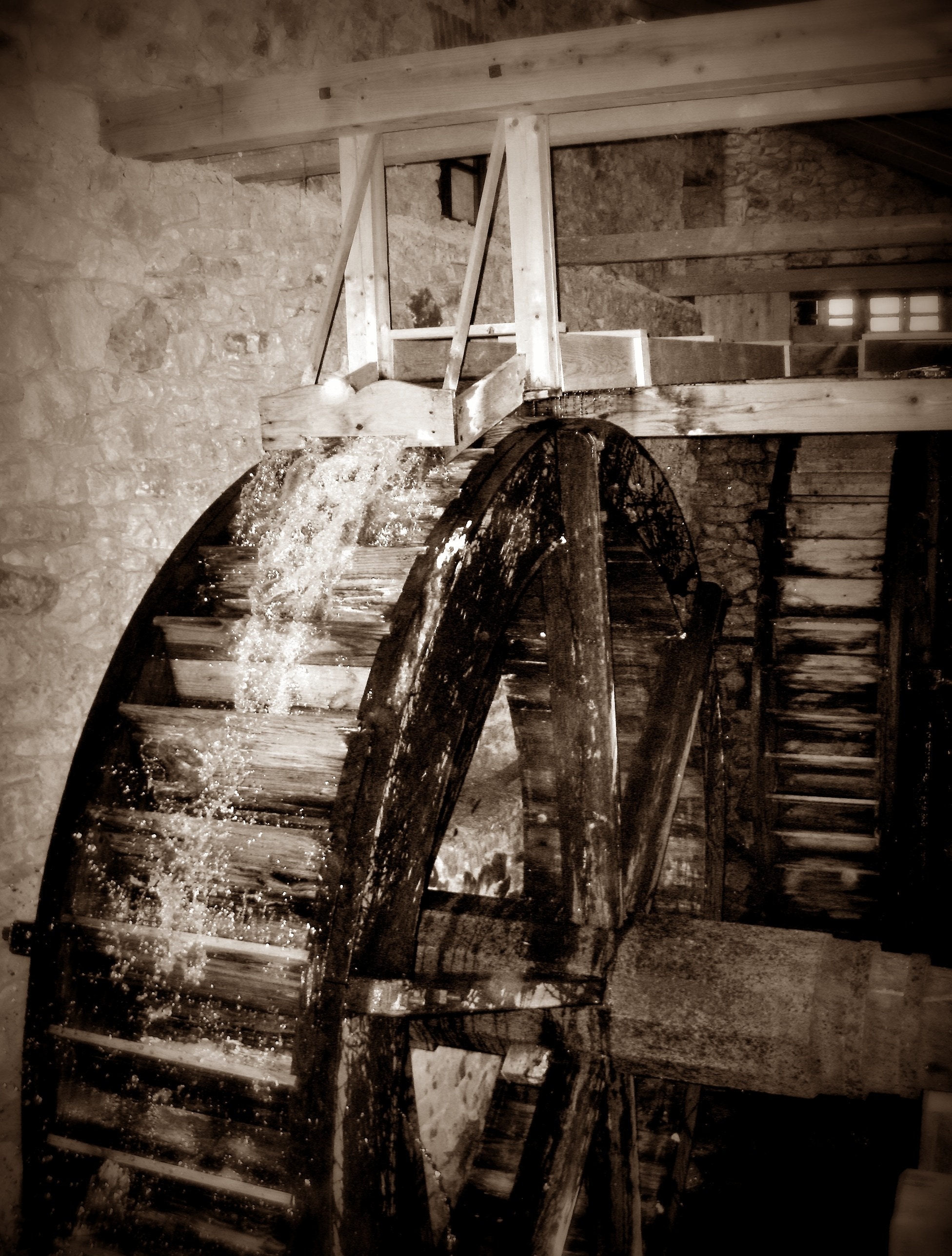 brown and white wooden water mill