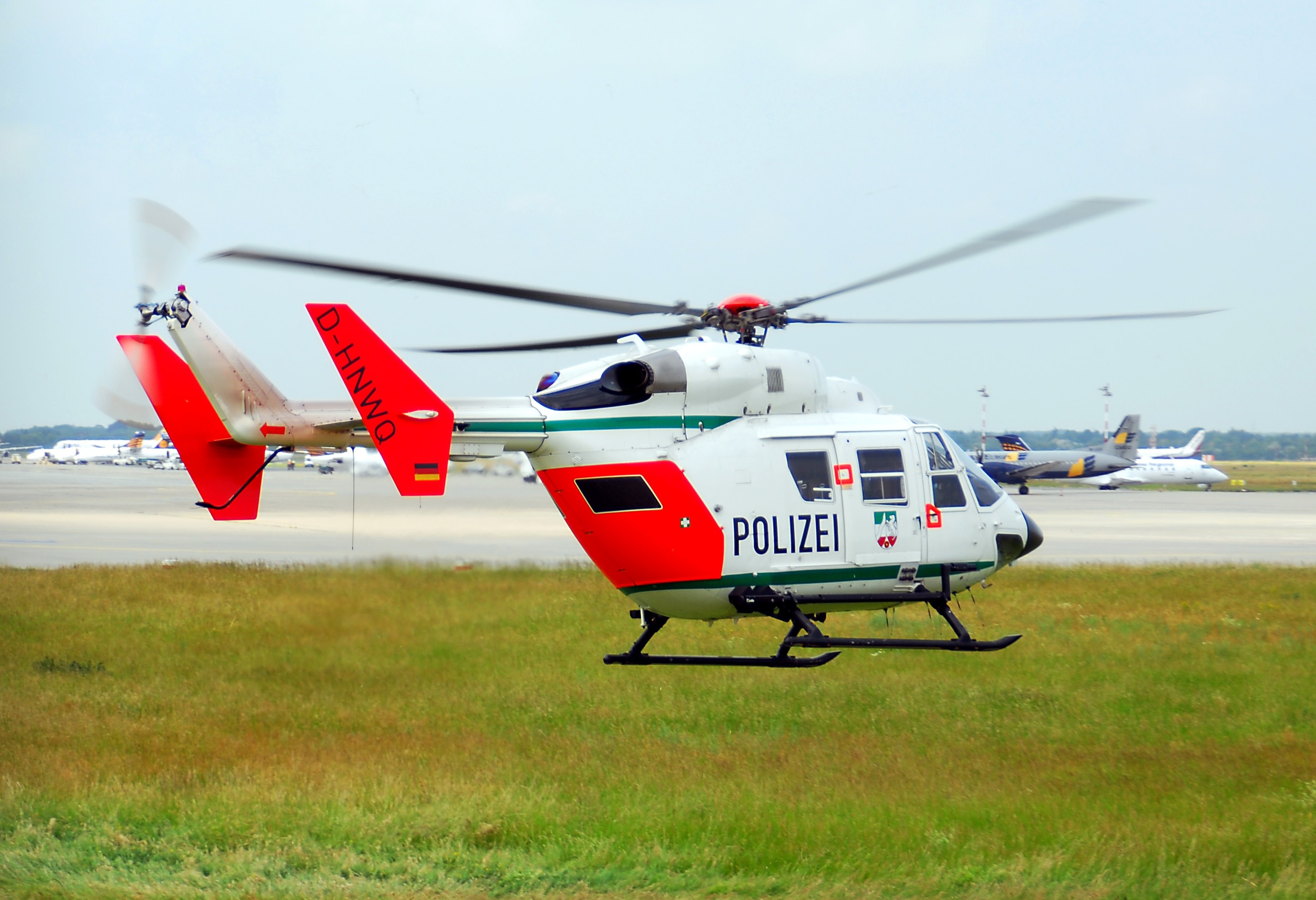white and red polizei helicopter