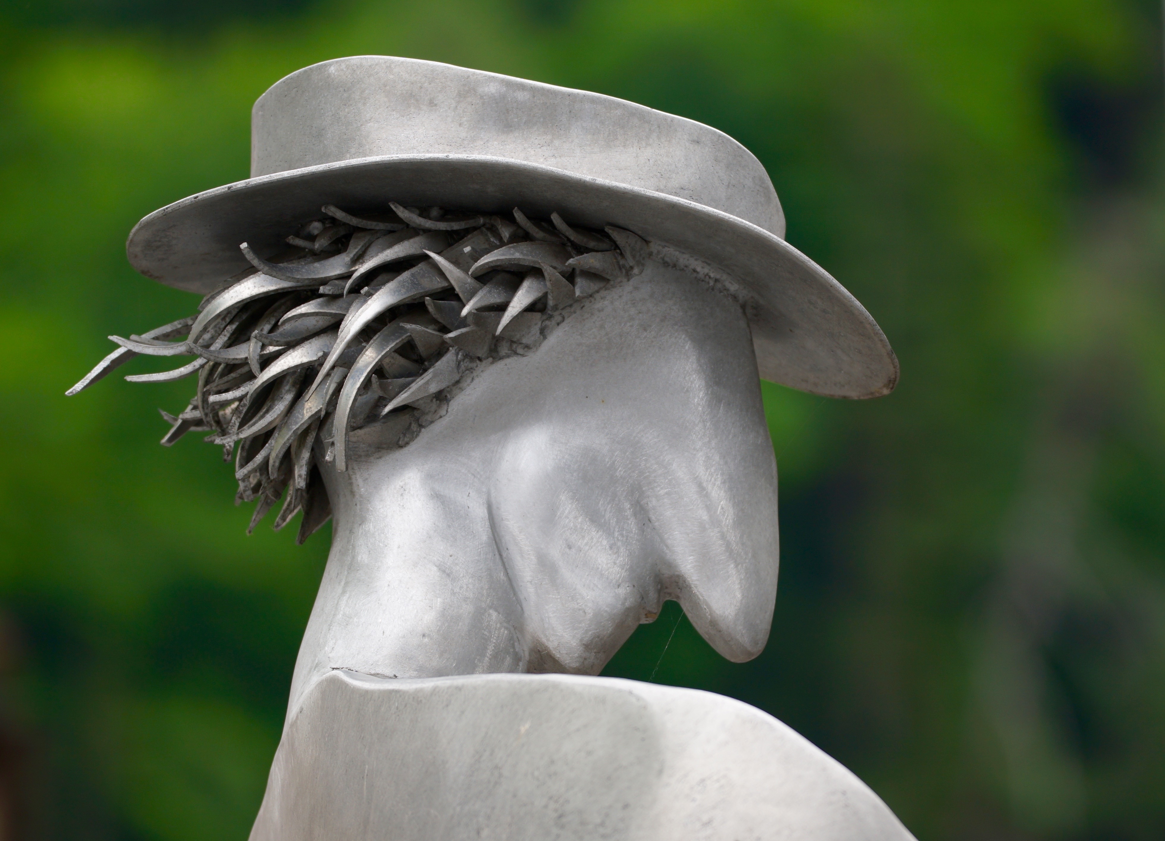 white human face shape with hat sculpture