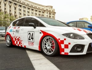 white and red stock car hatchback thumbnail