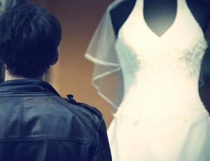 men's black leather jacket and women's white bridal gown thumbnail