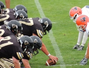 tow football team playing in football field thumbnail