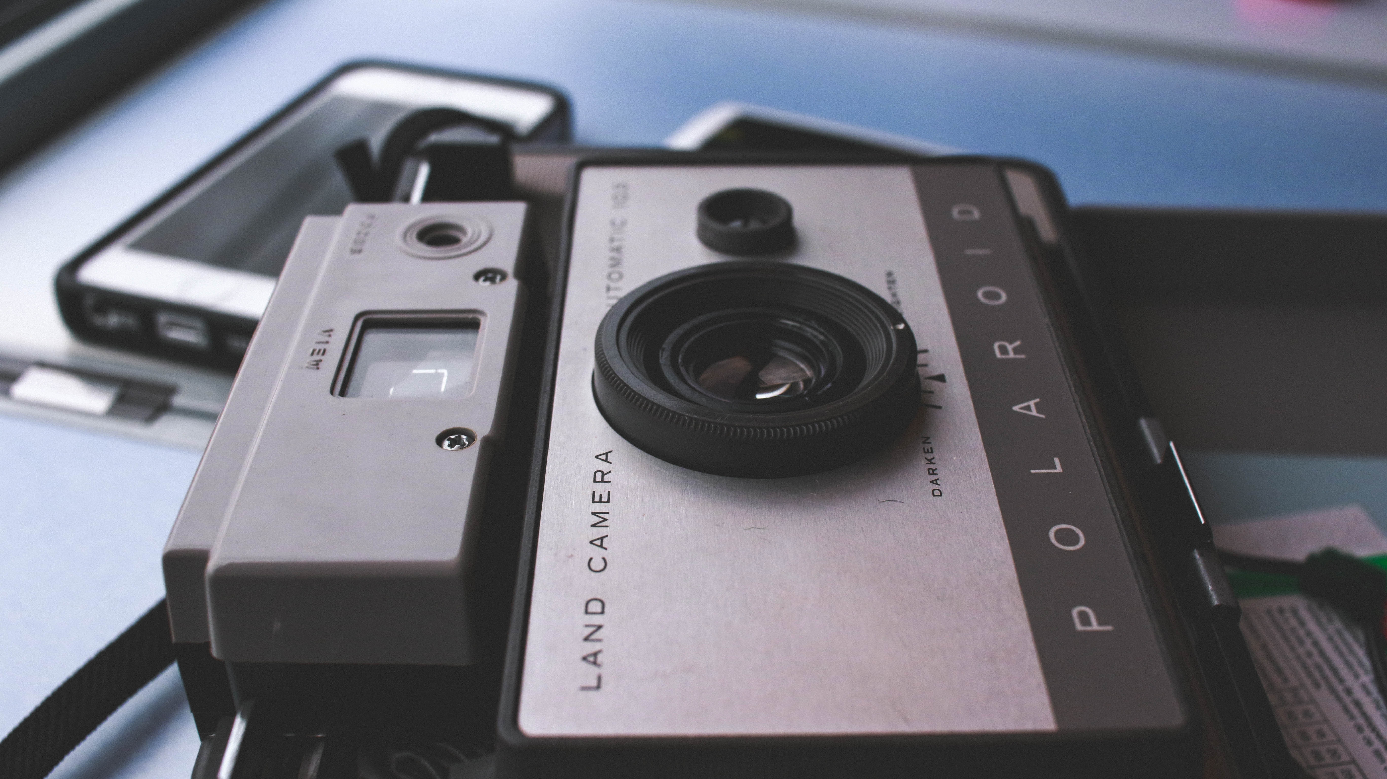 black and gray polaroid land camera