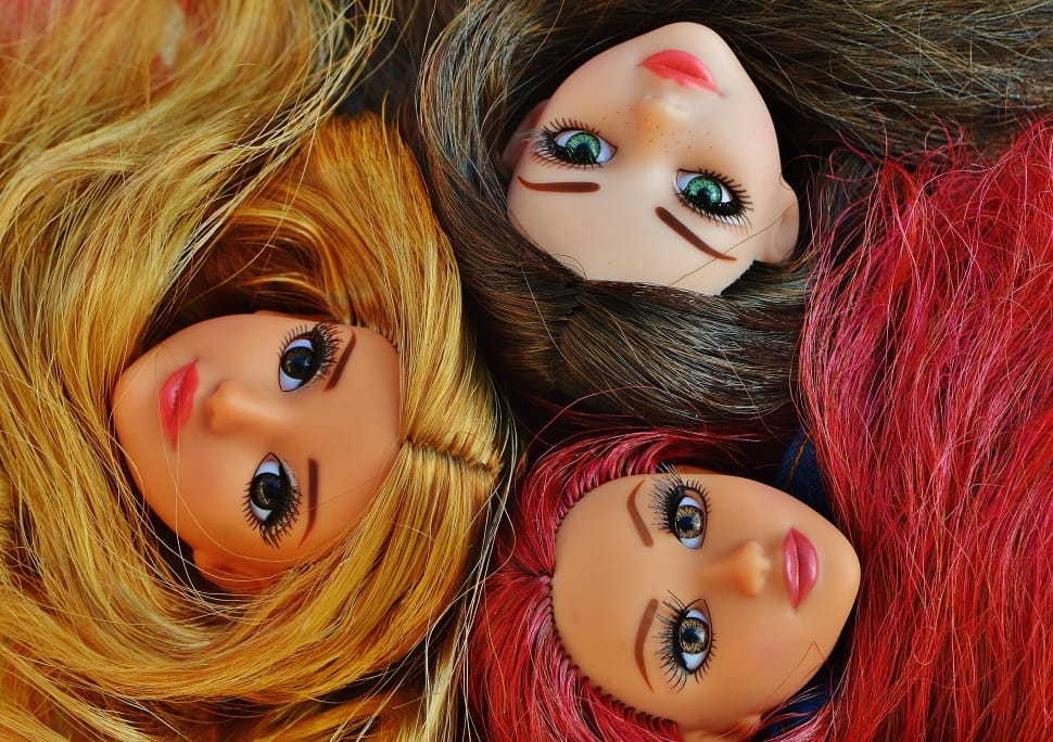 three barbie dolls