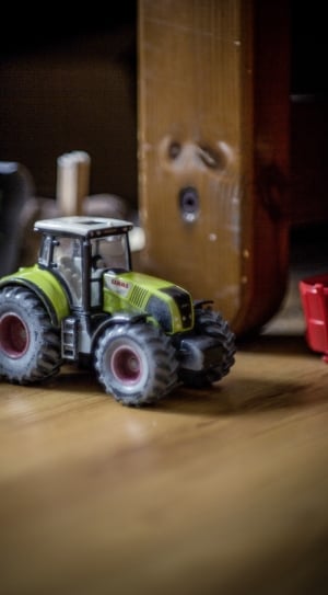 selective photography of gray tractor toy thumbnail