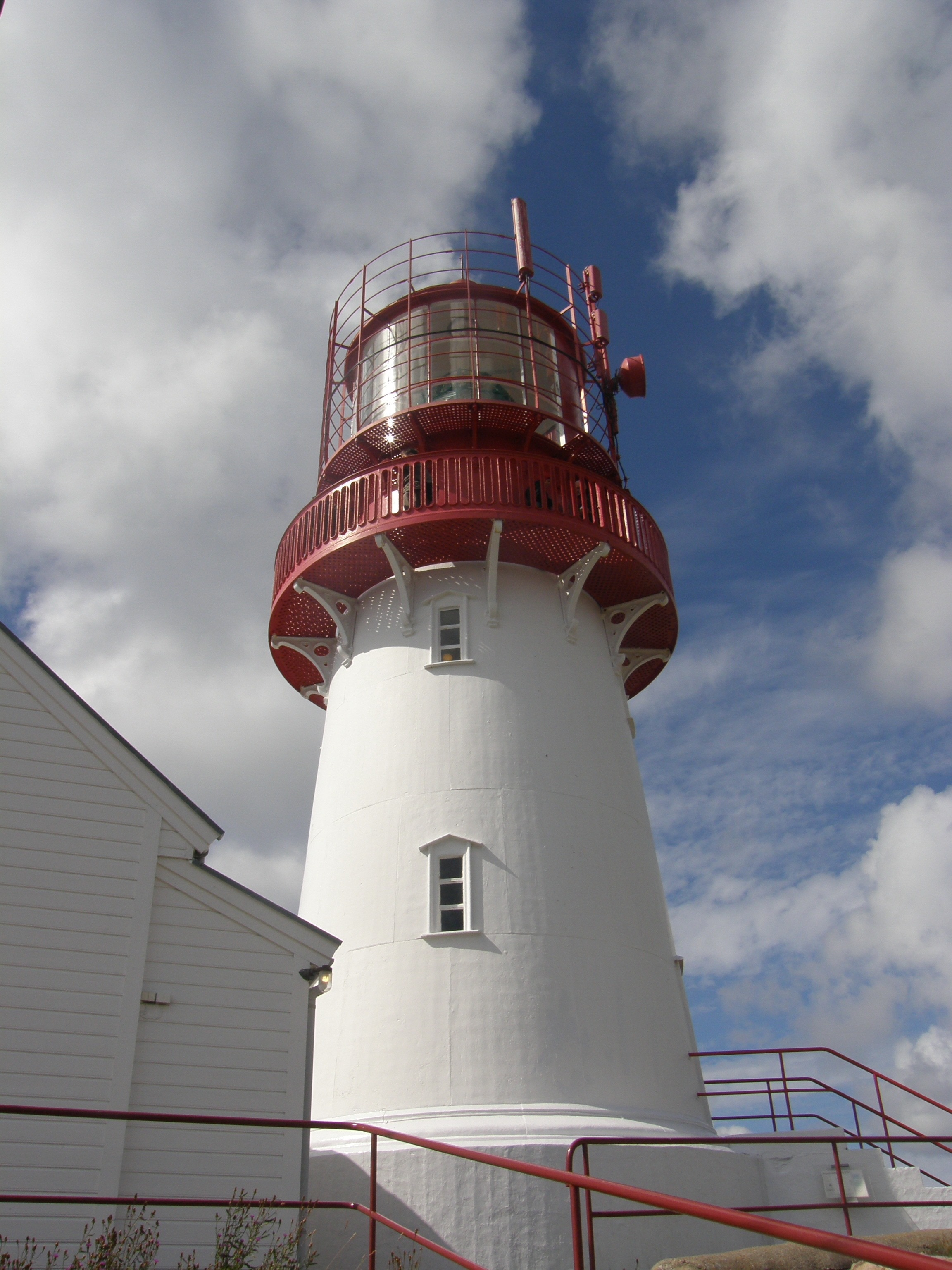 white and red lighthouse tower