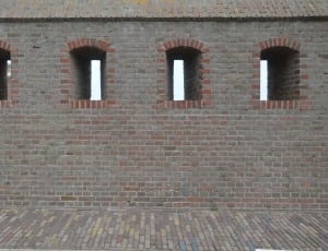 grey and brown bricks building at daytime thumbnail
