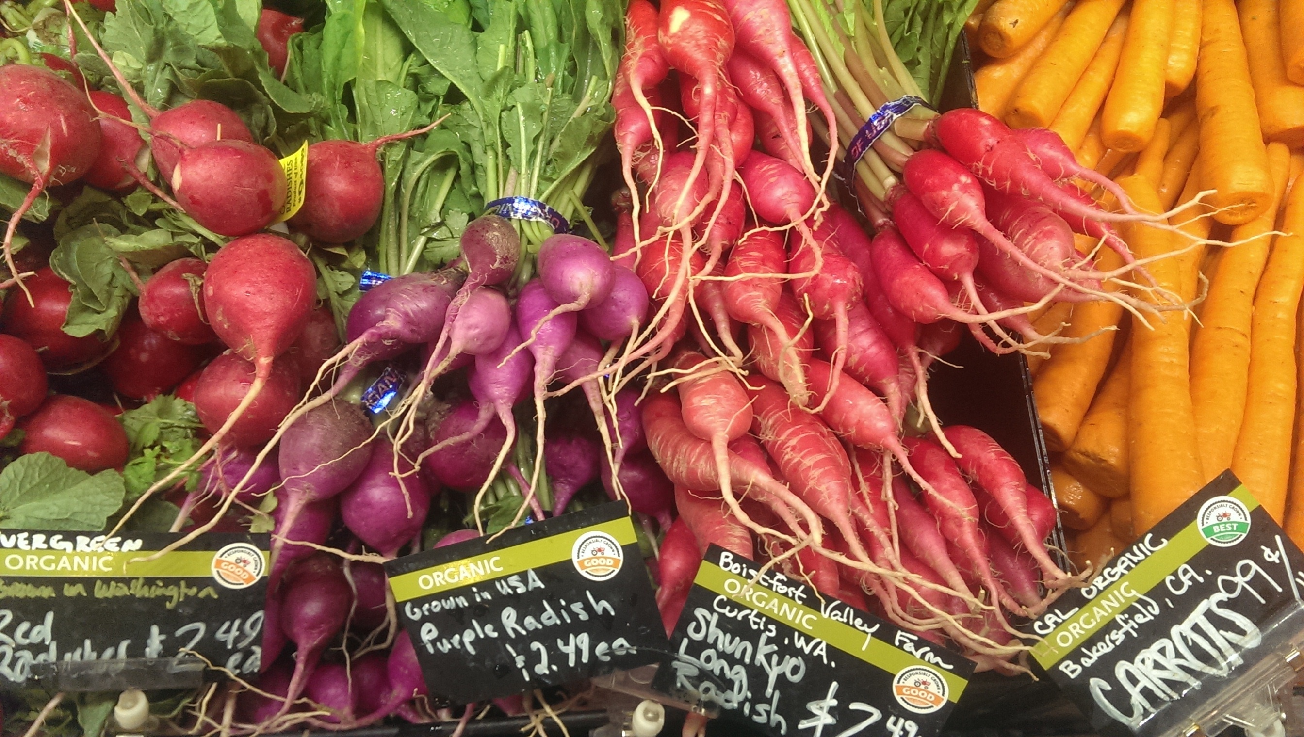 purple radish, shunkyo long radish and carrots display
