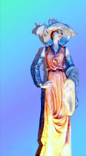 woman wearing orange maxi dress ceramic figurine thumbnail