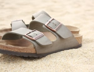 pair of gray and brown slip on sandals thumbnail