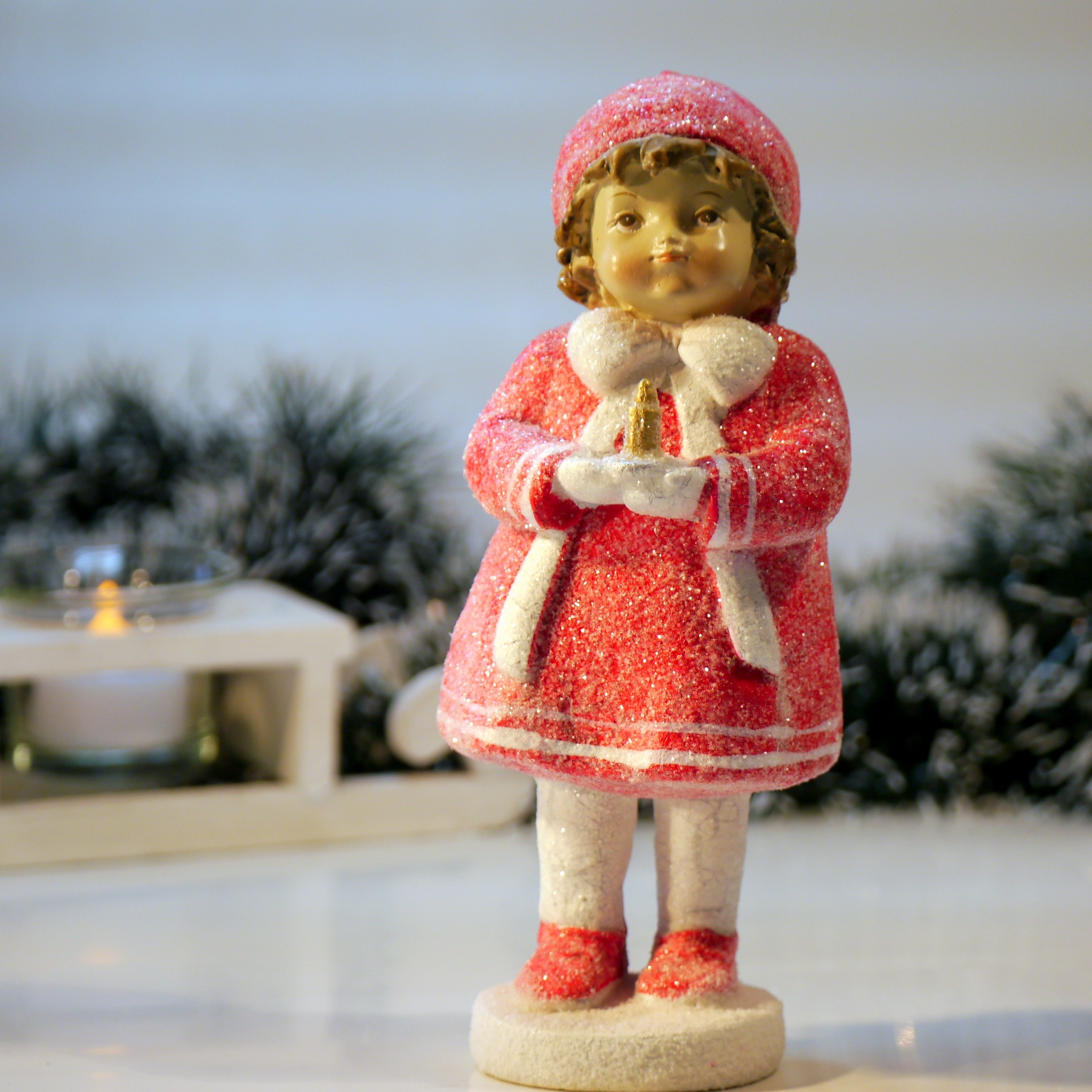 female child in red dress figurine