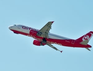 red and white airliner thumbnail
