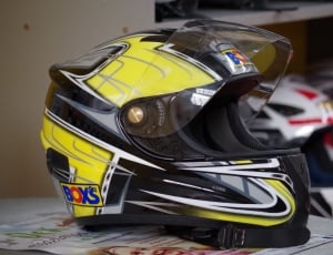 yellow white and black motorcycle helmet thumbnail