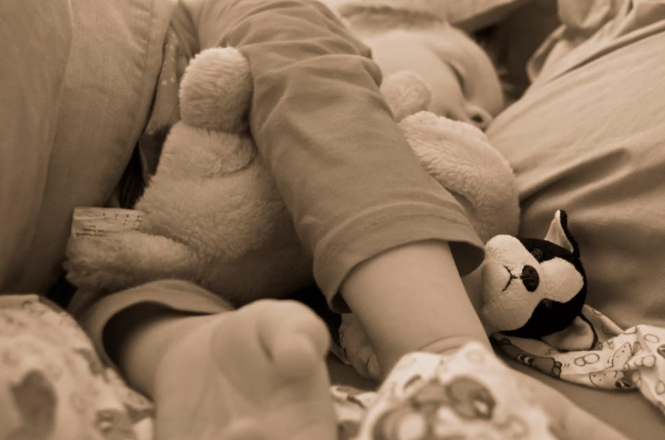 grayscale photography of toddler sleeping preview