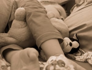 grayscale photography of toddler sleeping thumbnail