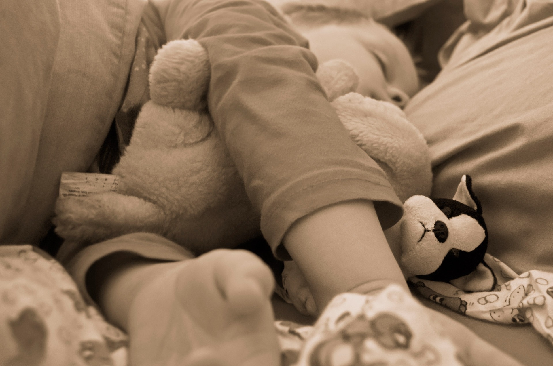 grayscale photography of toddler sleeping