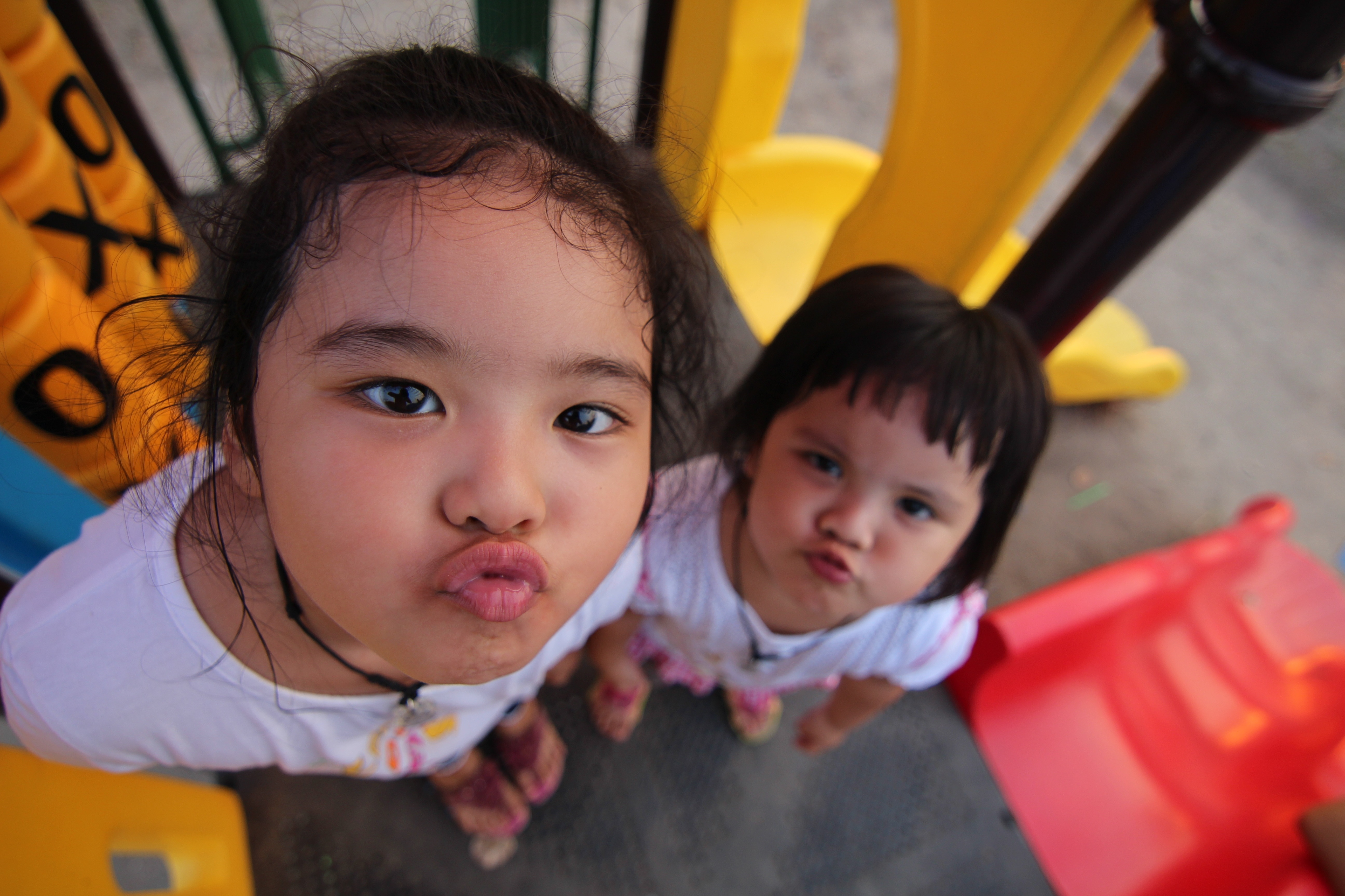 two girls in white crew neck shirts