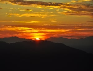 silhouette of mountains during sunset thumbnail