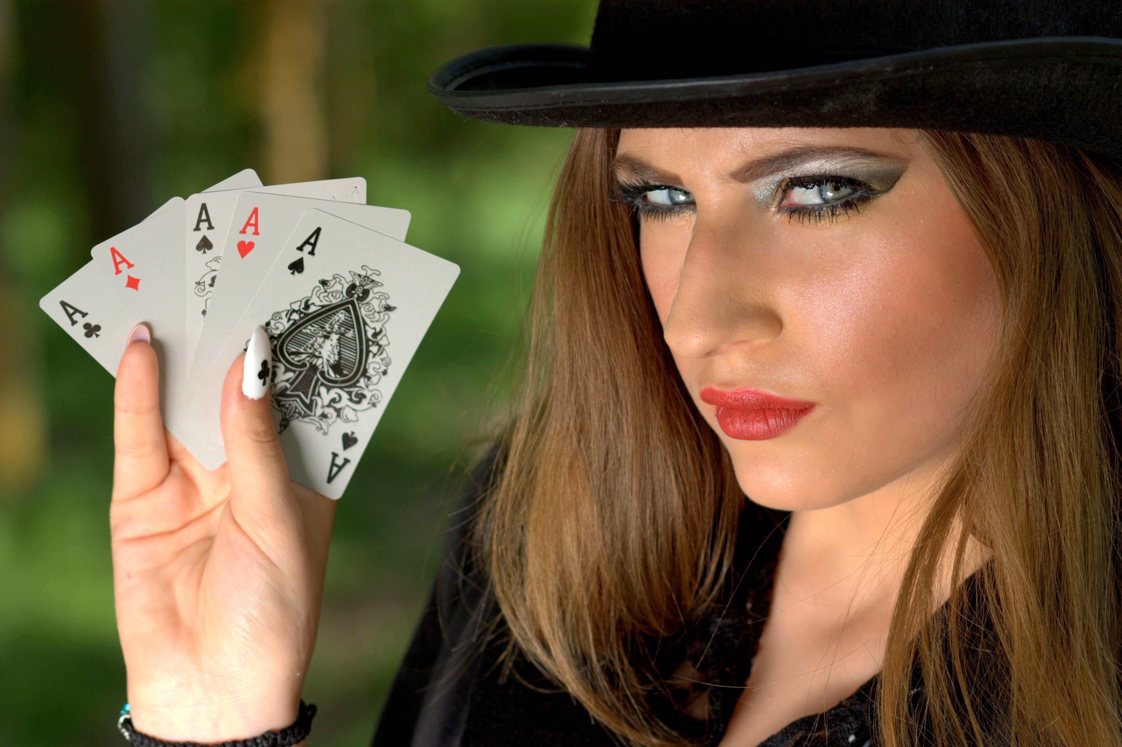 women's black shirt and aces playing card