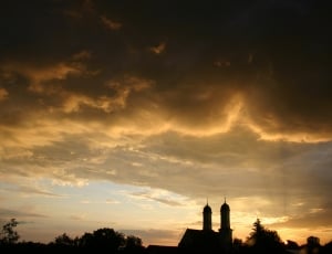 silhouette photo of church under white sky thumbnail