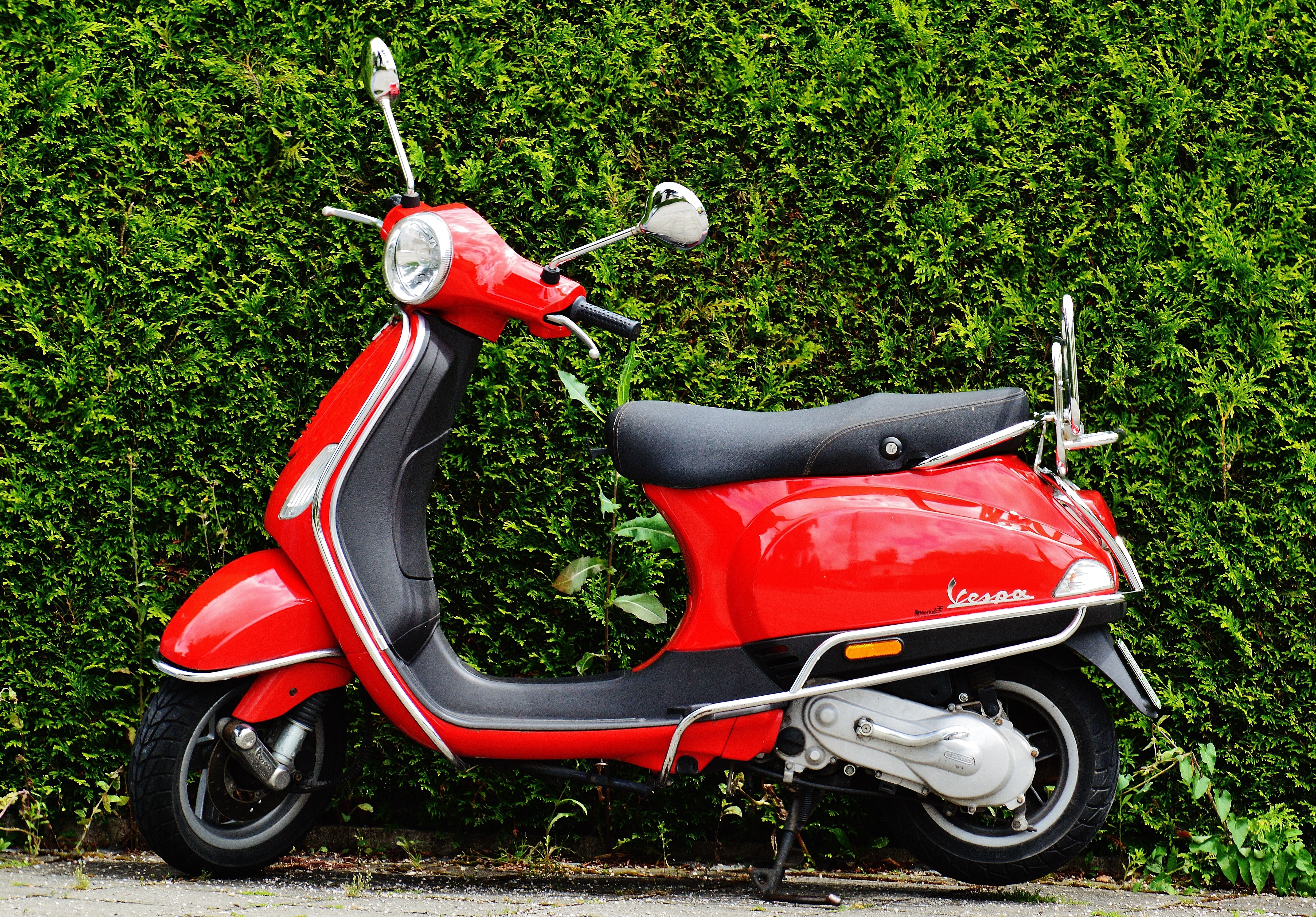 red and black motor scooter