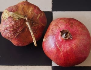 two red vegetables on black and white surface thumbnail