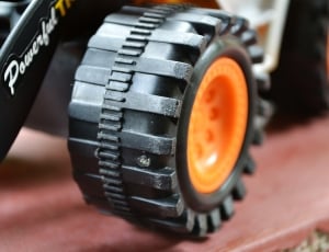 orange and black car wheel toy thumbnail