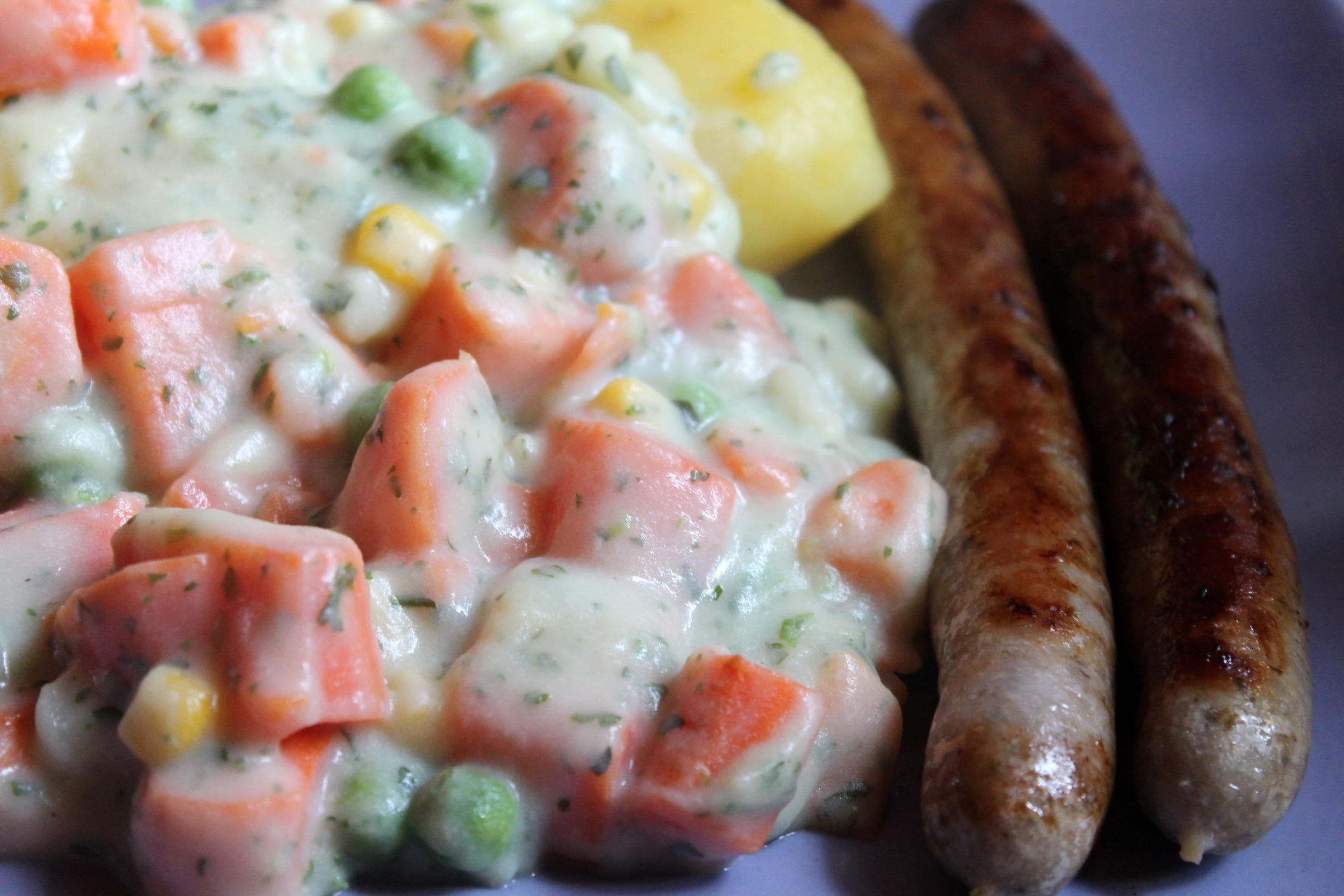 vegetable salad and 2 sausages