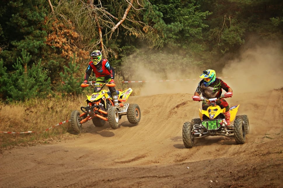 two men racing riding on atv preview