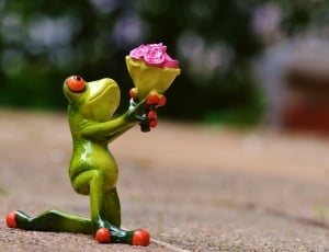 ceramic figure of green frog with flowers thumbnail