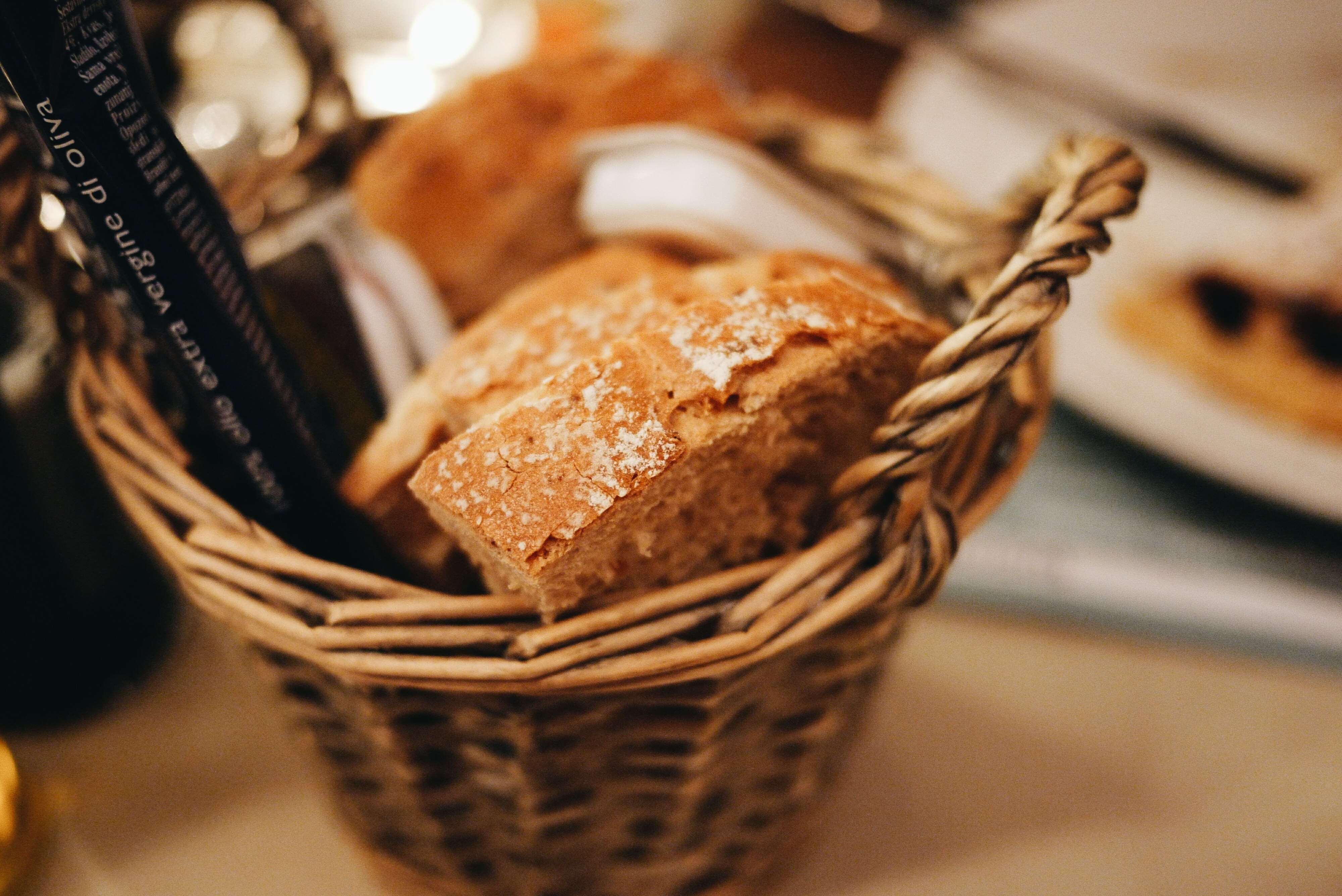 brown wicker basket with loaf bread
