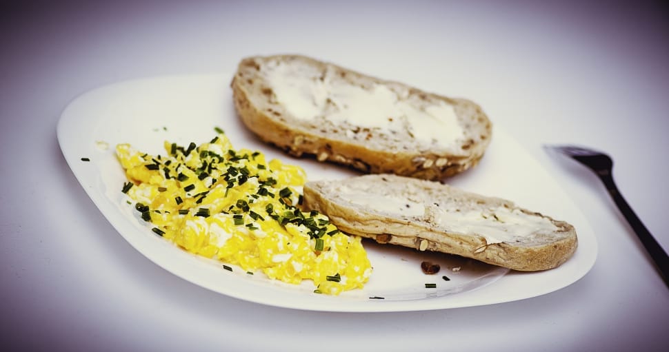 bread with butter and scrambled eggs with pepper preview