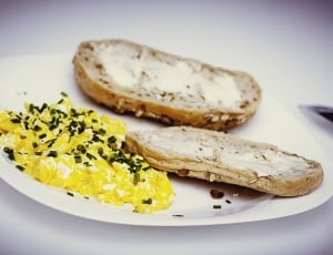 bread with butter and scrambled eggs with pepper thumbnail