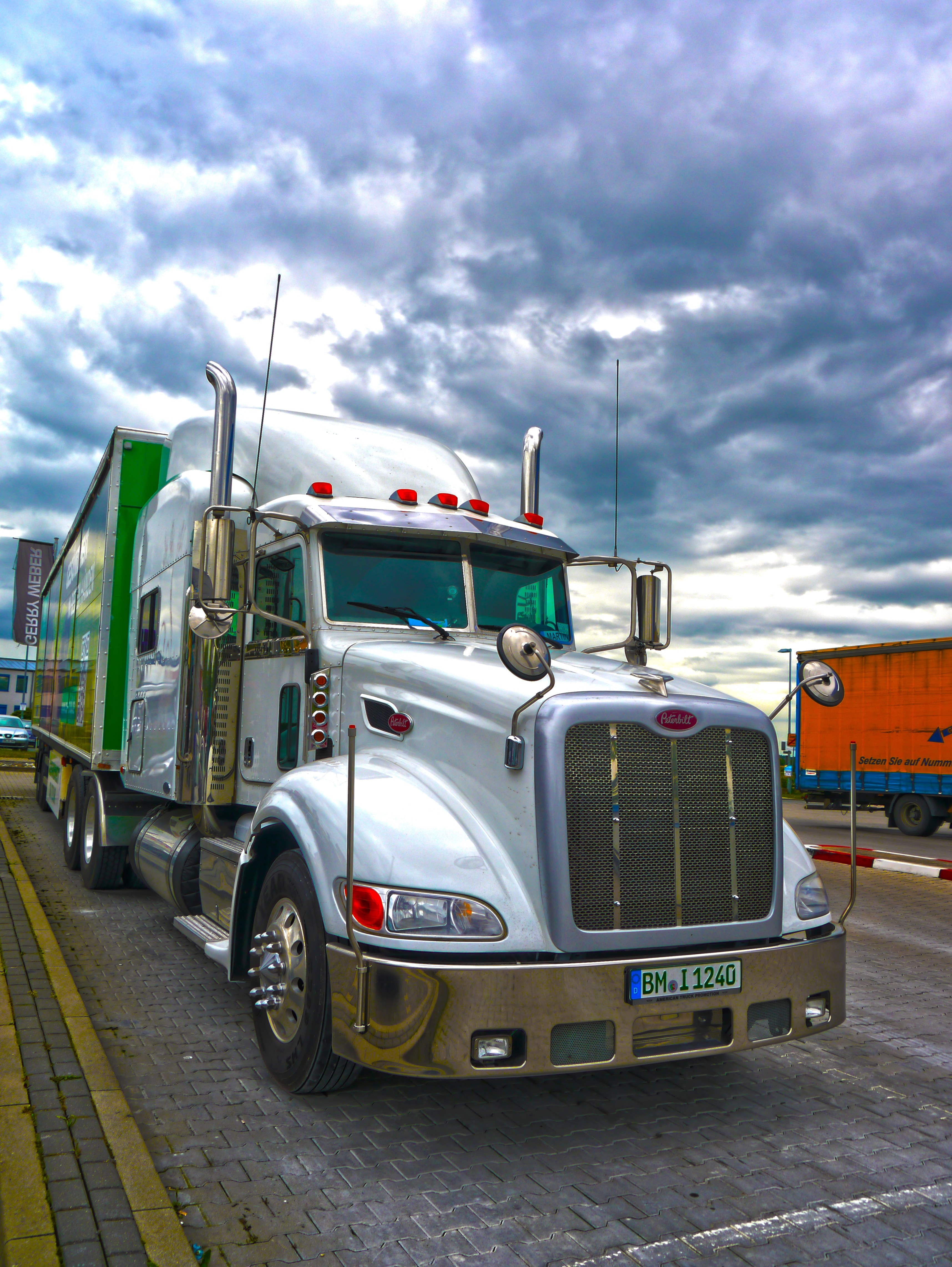 silver and green freight truck