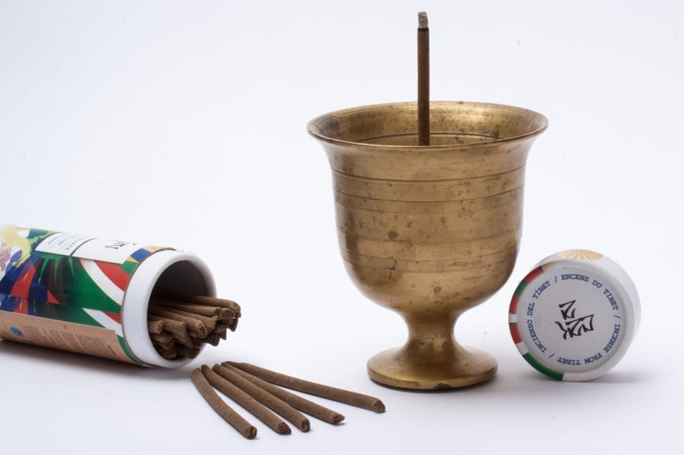 brass goblet with brown stick on the bottle preview