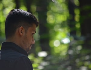 man wearing black long sleeve shirt during daytime thumbnail