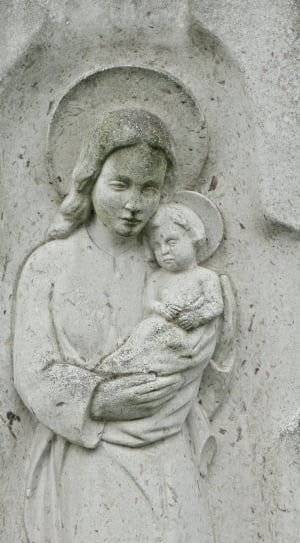 woman carrying baby statue thumbnail