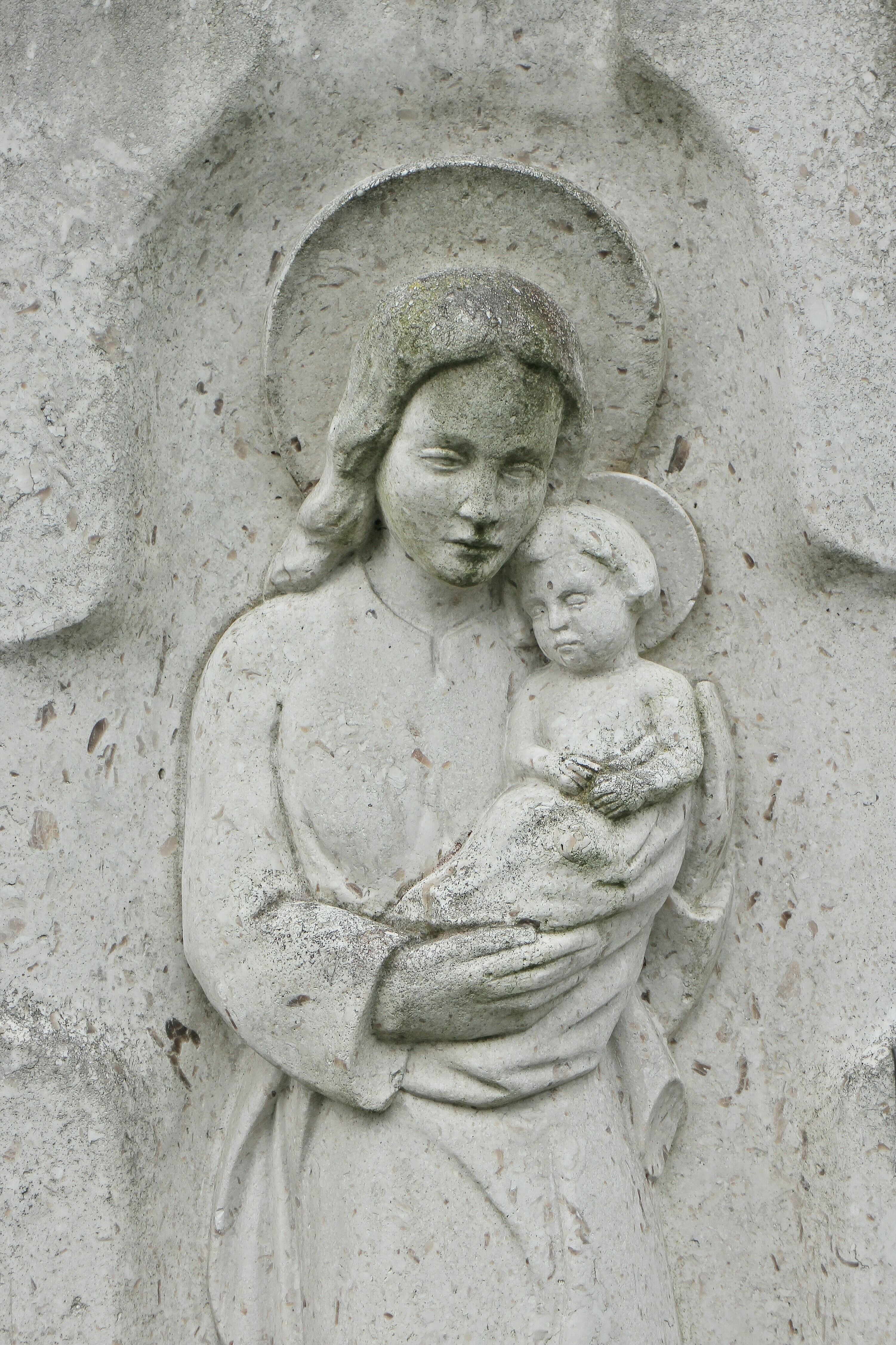 woman carrying baby statue