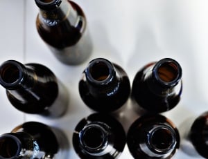 eight brown glass bottles on white surface thumbnail
