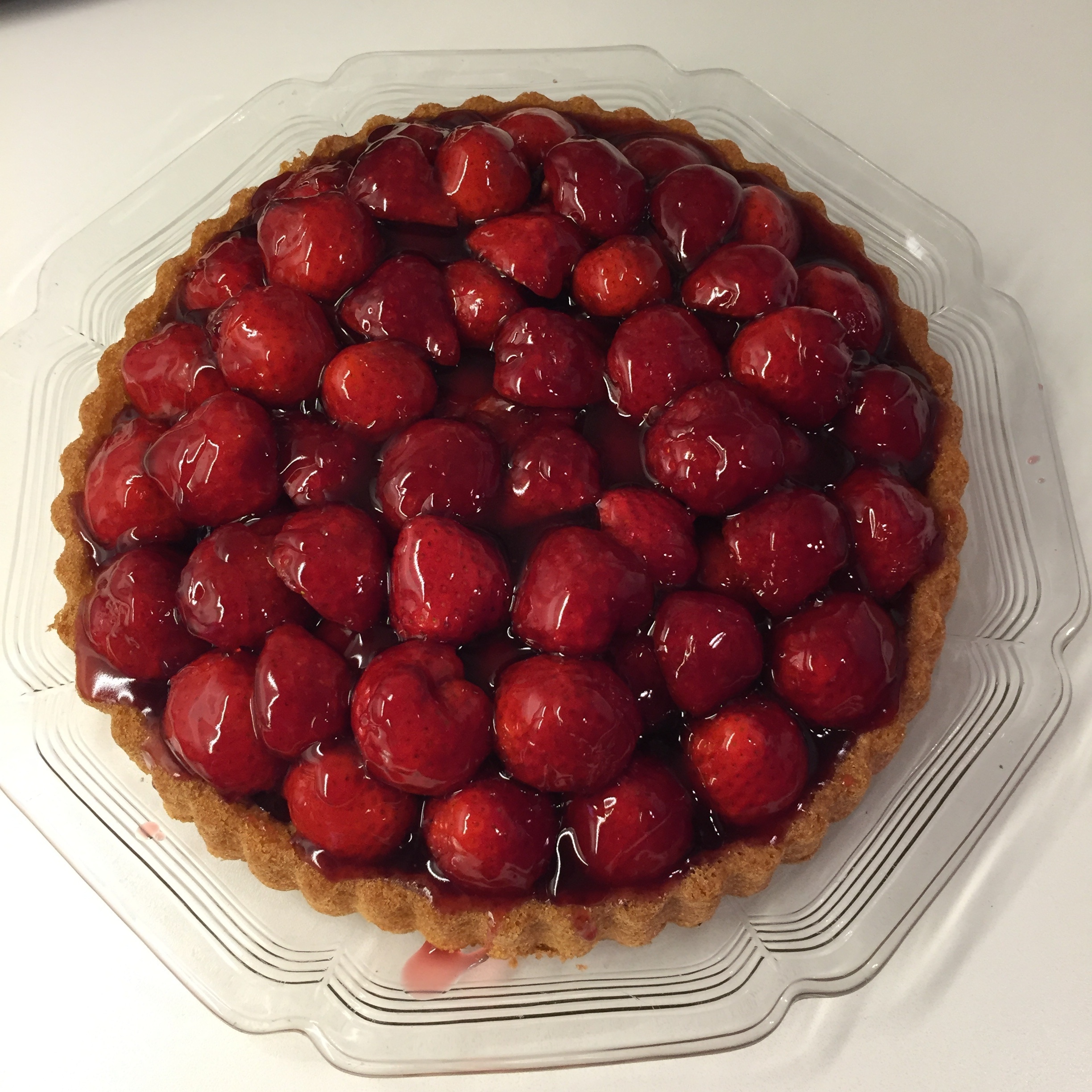 strawberry pie cake serve on round glass plate