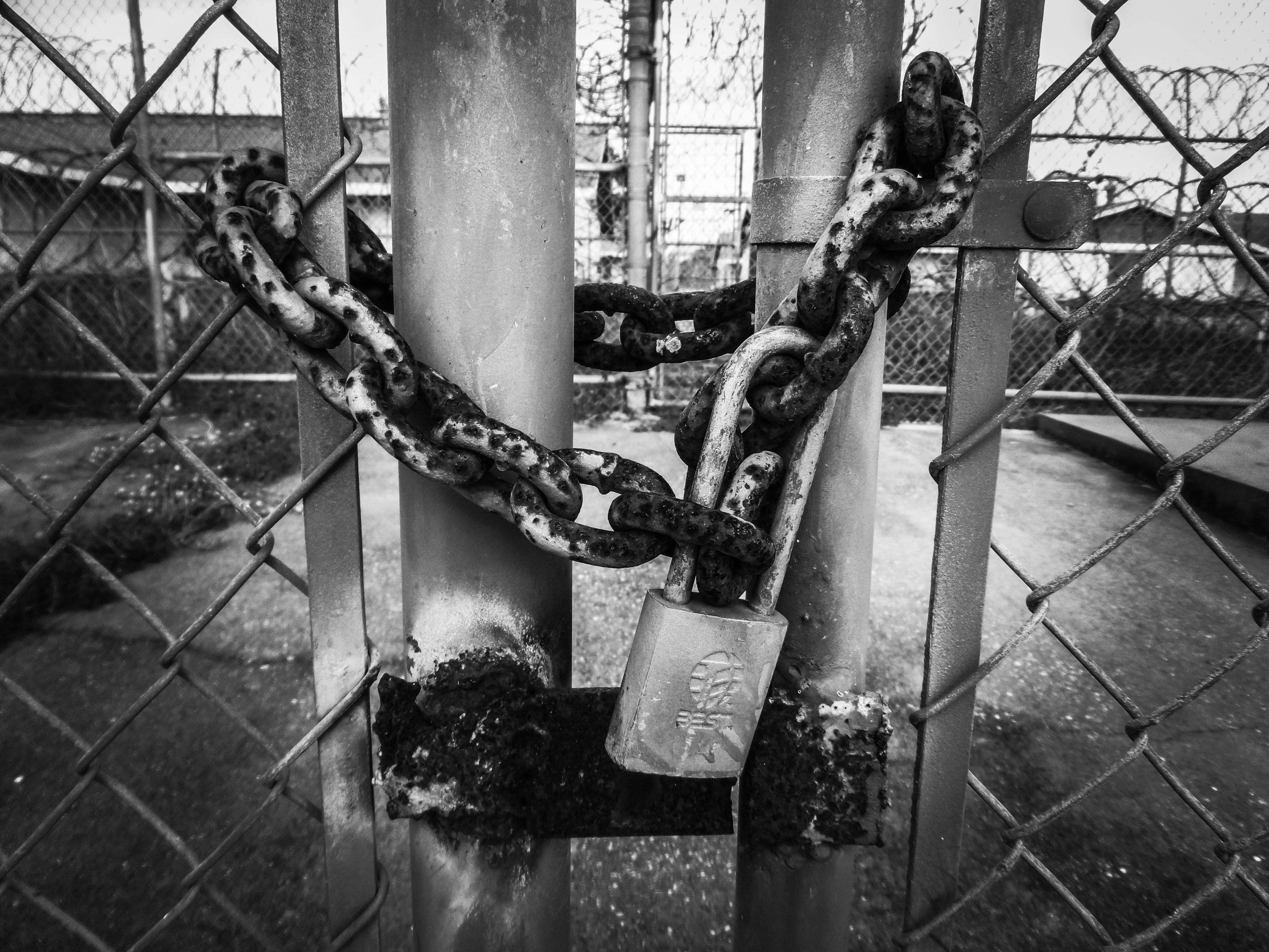 grayscale photography of chain and padlock