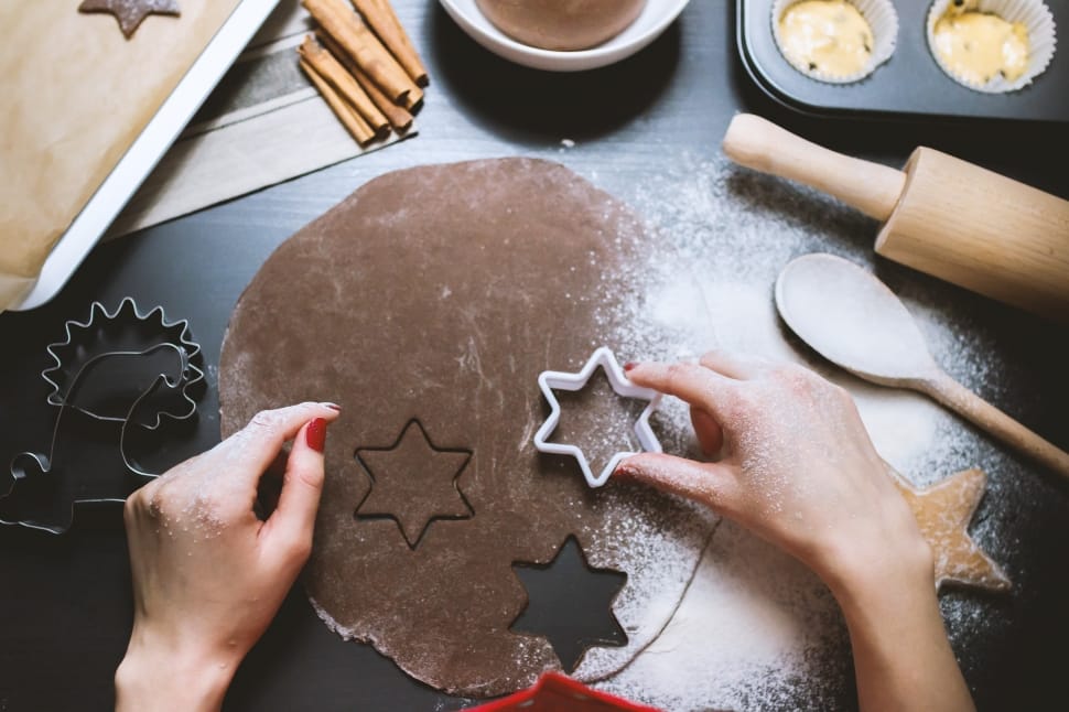person holding star shaped cookie cutter preview