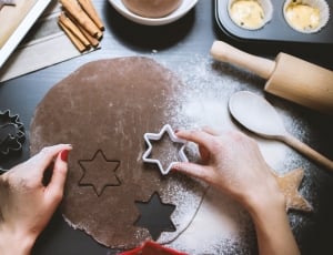person holding star shaped cookie cutter thumbnail