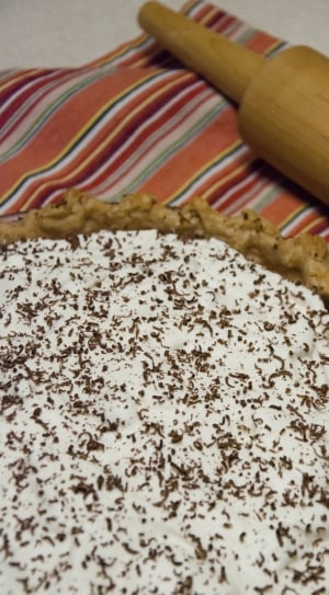 creamed pie and brown wooden rolling pin thumbnail